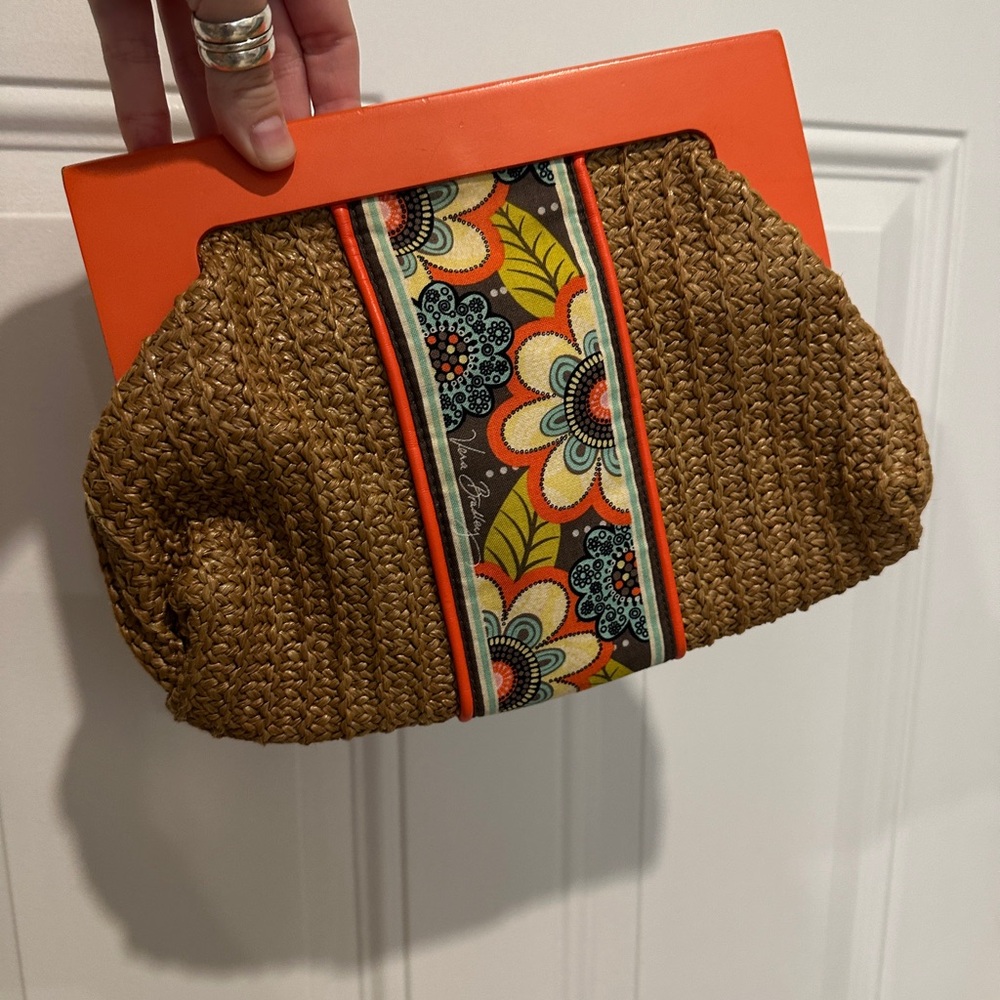 Vera Bradley woven clutch with Floral & fabric accents. Magnetic closure.